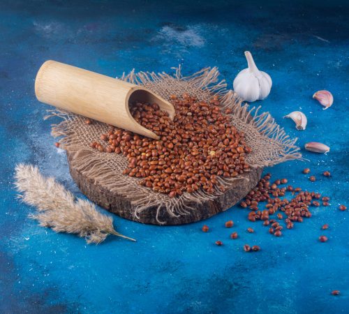 pile-raw-small-beans-placed-blue-surface